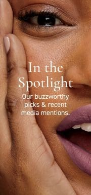 Here's an alt tag for the image: Woman's face, close-up, purple lipstick.